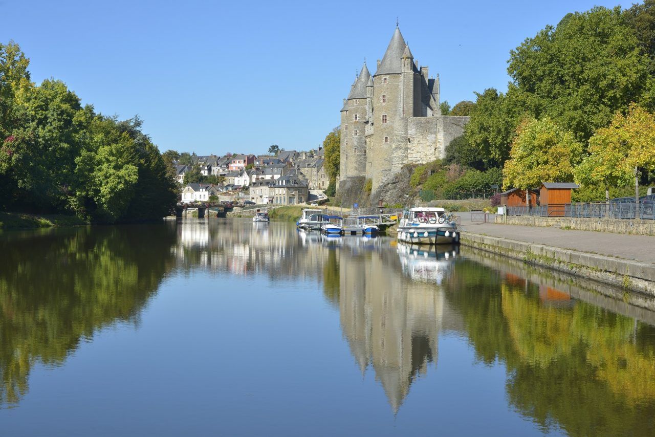 Castle of Rohan on the banks of Oust, part of canal Nantes at Brest, at Josselin, a commune in the Morbihan department in Brittany in north-western France